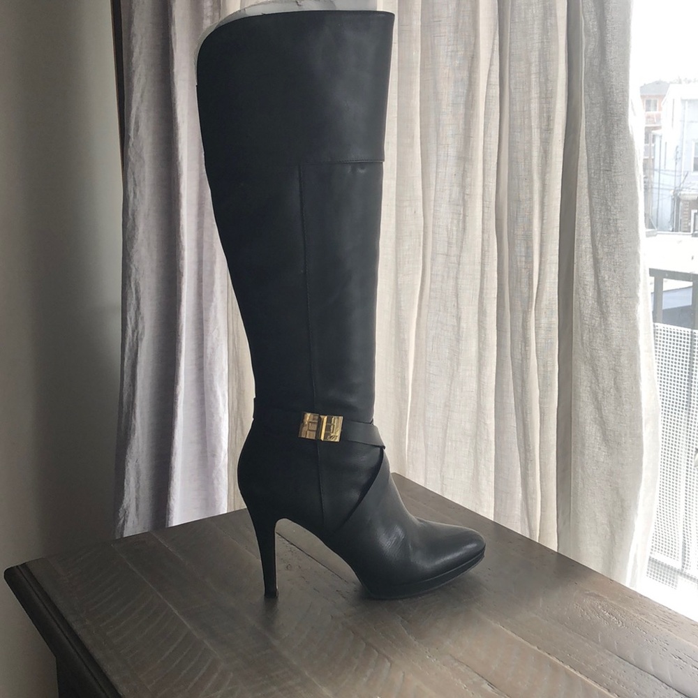 Below knee black leather boots